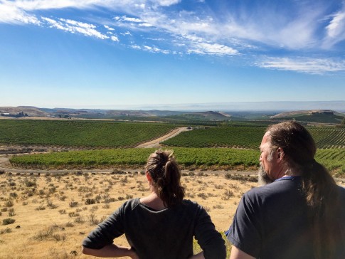 Mark & Renee look down the mountain and over the vineyard toward the Gorge